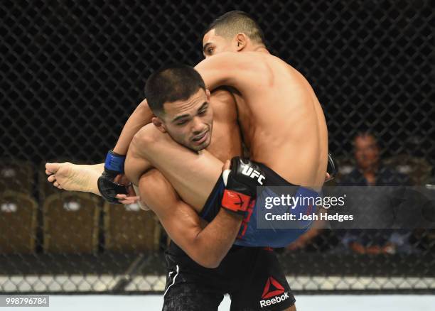 Elias Garcia attempts to takedown Mark De La Rosa in their flyweight fight during the UFC Fight Night event inside CenturyLink Arena on July 14, 2018...