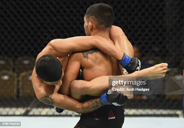 Elias Garcia attempts to takedown Mark De La Rosa in their flyweight fight during the UFC Fight Night event inside CenturyLink Arena on July 14, 2018...