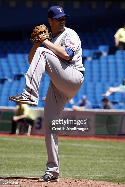 Colby Lewis of the Texas Rangers throws against the Toronto Blue Jays during a MLB game at the Rogers Centre on May 16, 2010 in Toronto, Ontario,...