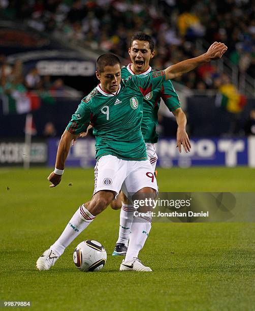 Javier Hernandez of Mexico passes the ball against Senegal during an international friendly at Soldier Field on May 10, 2010 in Chicago, Illinois....