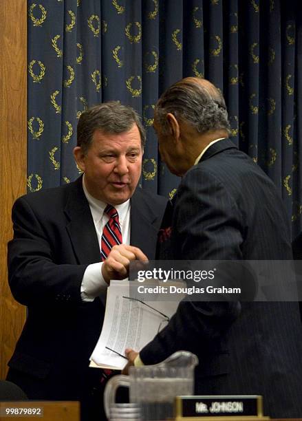 Chris Cannon, R-UT talks with John Conyers, D-MI., after the Subcommittee on Commercial and Administrative Law Subcommittee Meeting to Consider...