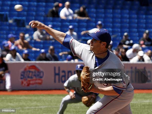 Colby Lewis of the Texas Rangers throws against the Toronto Blue Jays during a MLB game at the Rogers Centre on May 16, 2010 in Toronto, Ontario,...