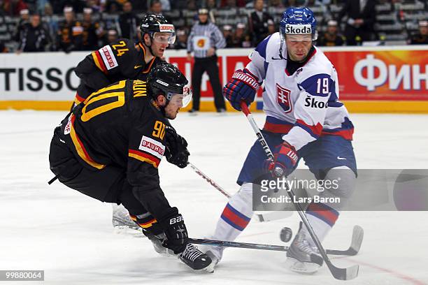 Constantin Braun of Germany blocks a shot by Tomas Starosta of Slovakia during the IIHF World Championship qualification round match between Slovakia...