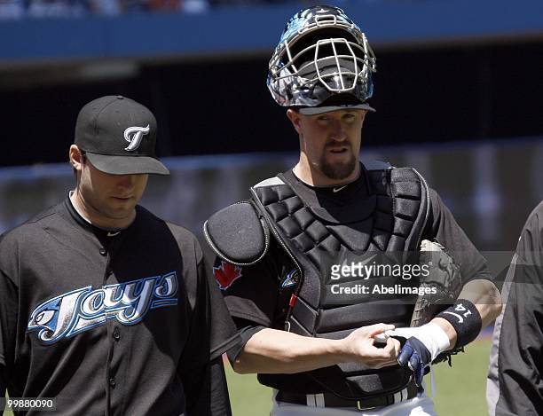 John Buck and Brandon Morrow of the Toronto Blue Jays walk out to play the Texas Rangers during a MLB game at the Rogers Centre on May 16, 2010 in...