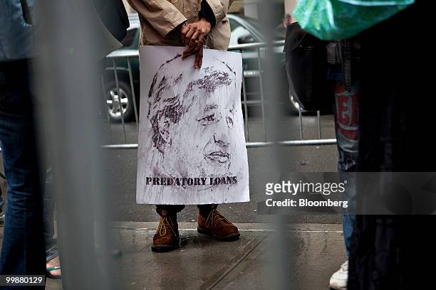 Sign bearing a likeness of Jamie Dimon, chairman and chief executive officer of JPMorgan Chase & Co. Is held by a demonstrator outside One Chase...