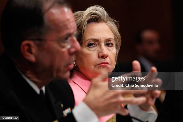 Secretary of State Hillary Clinton listens to Chairman of the Joint Chiefs of Staff Admiral Michael Mullen testify before the Senate Foreign...