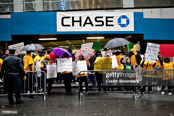 Demonstrators with the Neighborhood Assistance Corporation of America protest outside One Chase Plaza during the annual shareholders meeting of...