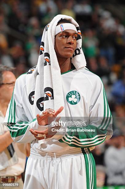Rajon Rondo of the Boston Celtics looks on from the sideline during the game against the Indiana Pacers on March 12, 2010 at the TD Garden in Boston,...