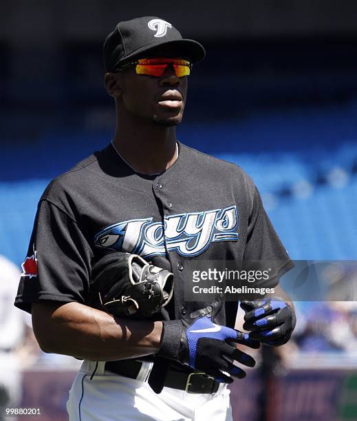 Fred Lewis of the Toronto Blue Jays walks to the dug-out after an inning against the Texas Rangers during a MLB game at the Rogers Centre on May 16,...