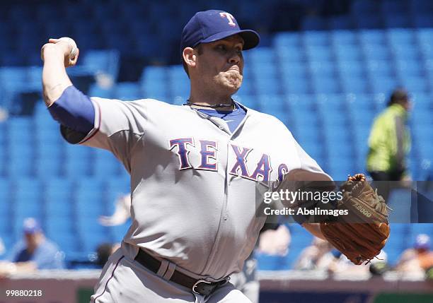 Colby Lewis of the Texas Rangers throws against the Toronto Blue Jays during a MLB game at the Rogers Centre on May 16, 2010 in Toronto, Ontario,...