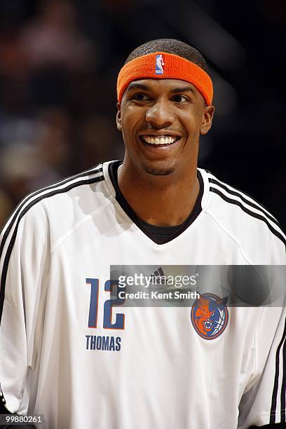 Tyrus Thomas of the Charlotte Bobcats looks on with a smile during the game against the Miami Heat at Time Warner Cable Arena on March 9, 2010 in...