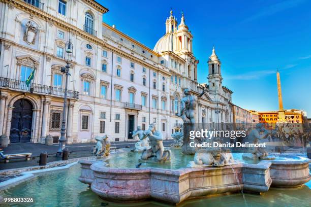 fountain of four rivers (fontana dei quattro fiumi) and saint agnese church (sant'agnese in agone), piazza navona, rome, italy - fountain of the four rivers stock pictures, royalty-free photos & images