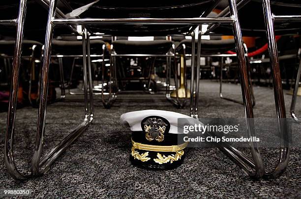 Chairman of the Joint Chiefs of Staff Admiral Michael Mullen's hat is stowed underneath a chair before he testifies before the Senate Foreign...