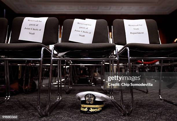 Chairman of the Joint Chiefs of Staff Admiral Michael Mullen's hat is stowed underneath a chair before he testifies before the Senate Foreign...