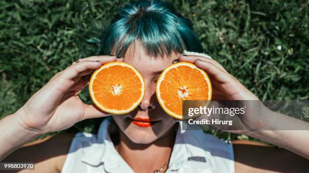 girl with green hair and orange - girl with orange hair stock pictures, royalty-free photos & images