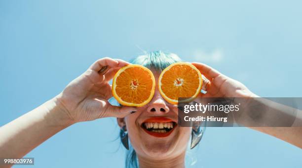 girl with green hair and orange - green hair stock pictures, royalty-free photos & images