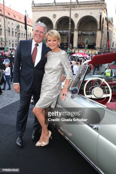 Host Ulrich Kowalewski and Uschi Glas near by a oldtimer car during the Mercedes-Benz reception at 'Klassik am Odeonsplatz' on July 14, 2018 in...