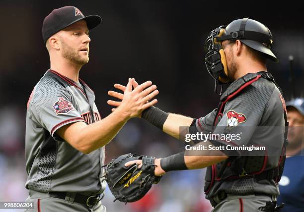 Brad Boxberger and Jeff Mathis of the Arizona Diamondbacks celebrate after the game against the Atlanta Braves at SunTrust Park on July 14, 2018 in...