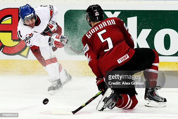 Petr Hubacek of Czech Republic tries to score against Marc Giordano of Canada during the IIHF World Championship group F qualification round match...