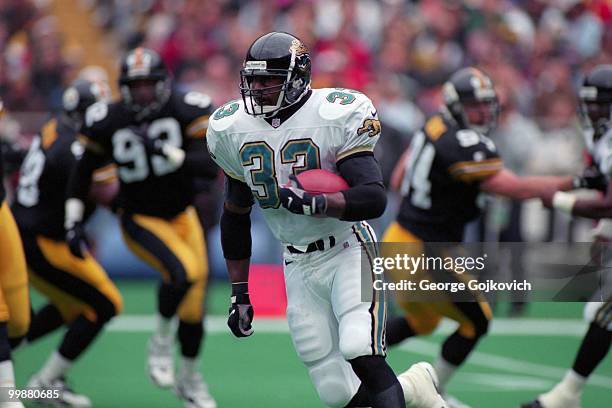 Running back James Stewart of the Jacksonville Jaguars runs with the football during a game against the Pittsburgh Steelers at Three Rivers Stadium...