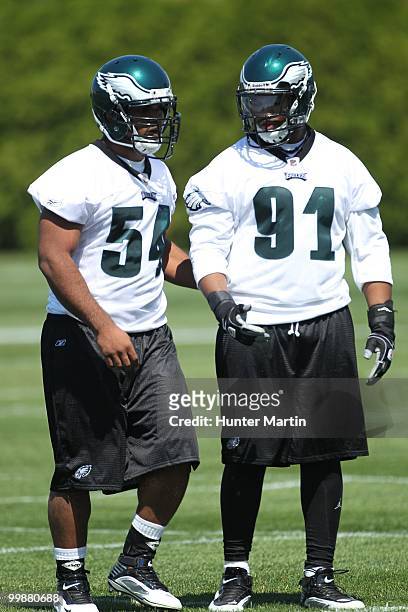 Defensive ends Brandon Graham and Darryl Tapp of the Philadelphia Eagles participate in drills during mini-camp practice on April 30, 2010 at the...