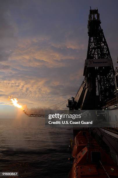 In this handout from the U.S. Coast Guard, Gas from the damaged Deepwater Horizon wellhead is burned by the drillship Discoverer Enterprise May 16,...