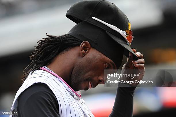 Outfielder Andrew McCutchen of the Pittsburgh Pirates removes his cap as he returns to the dugout during a game against the St. Louis Cardinals at...