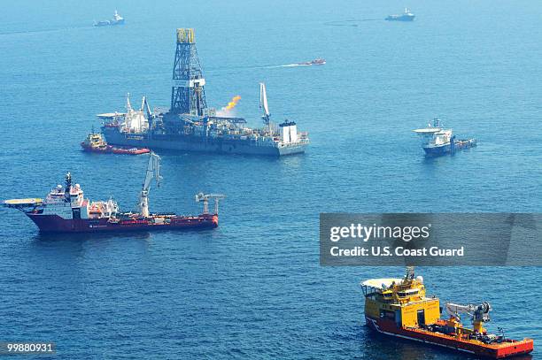 In this handout from theU.S. Coast Guard, Offshore supply vessels assist and observe the worksite of the Deepwater Horizon oil rig explosion May 17,...