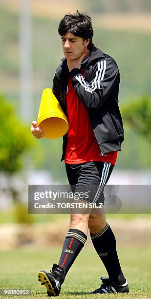 Germany's coach Joachim Loew gestures during a training session at the Verdura Golf and Spa resort, near Sciacca May 18, 2010. The German team is...