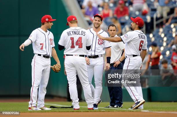 Trea Turner, Bryce Harper, Mark Reynolds and Anthony Rendon of the Washington Nationals talk before the game against the Boston Red Sox at Nationals...