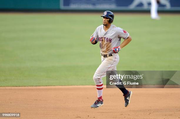 Xander Bogaerts of the Boston Red Sox rounds the bases after hitting a three-run home run in the fifth inning against the Washington Nationals at...