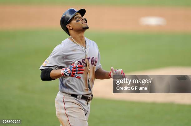 Xander Bogaerts of the Boston Red Sox celebrates after hitting a three-run home run in the fifth inning against the Washington Nationals at Nationals...