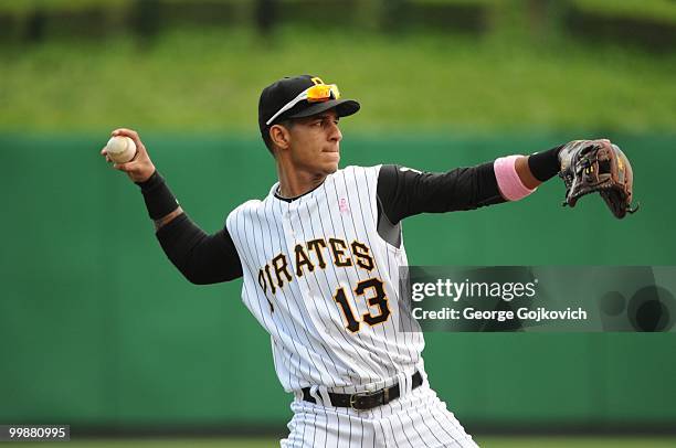 Shortstop Ronny Cedeno of the Pittsburgh Pirates throws to first base to warm up between innings during a game against the St. Louis Cardinals at PNC...