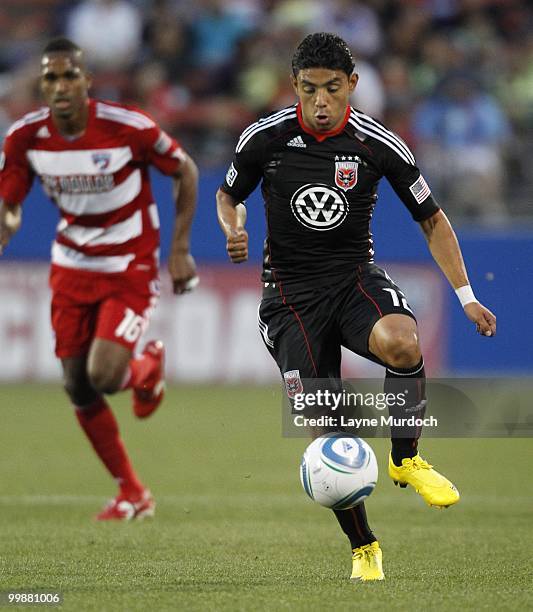 Christian Castillo of D.C. United dribbles the ball past Atiba Harris of FC Dallas at Pizza Hut Park on May 8, 2010 in Frisco, Texas.