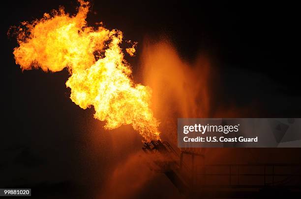 In this handout from the U.S. Coast Guard, Gas from the damaged Deepwater Horizon wellhead is burned by the drillship Discoverer Enterprise May 16,...