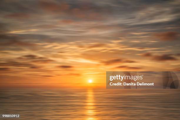 clouds at sunset above ocean, la jolla, california, usa - force de la nature stockfoto's en -beelden