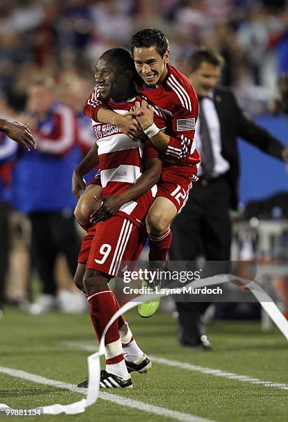 Jeff Cunningham of FC Dallas celebrates his winning goal with teammate Eric Avila against D.C. United at Pizza Hut Park on May 8, 2010 in Frisco,...