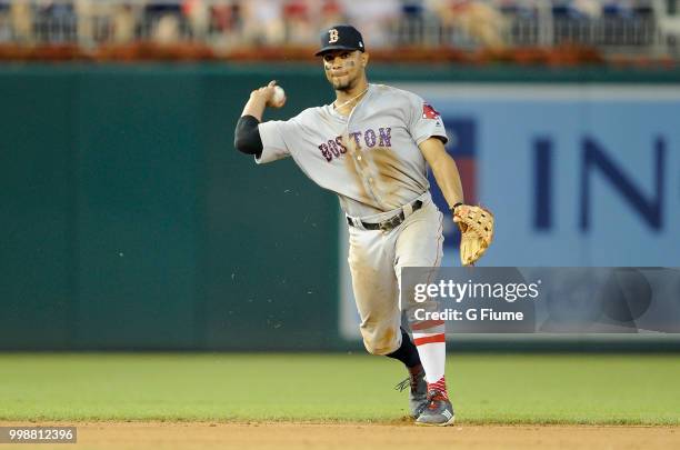 Xander Bogaerts of the Boston Red Sox throws the ball to first base against the Washington Nationals at Nationals Park on July 3, 2018 in Washington,...