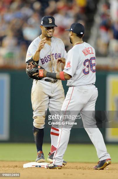 Eduardo Nunez of the Boston Red Sox celebrates with Xander Bogaerts after a victory against the Washington Nationals at Nationals Park on July 3,...