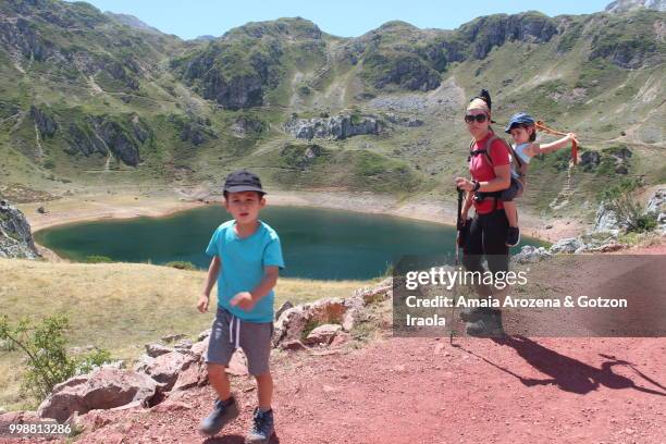 mother and children on cueva lake. somiedo natural park, asturias, spain. - ecological reserve stock pictures, royalty-free photos & images