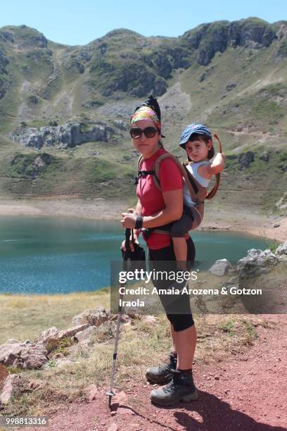 mother and daughter on cueva lake. somiedo natural park, asturias, spain. - ökologisches reservat stock-fotos und bilder