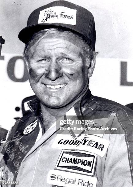 Cale Yarborough takes a few photos before the Atlanta 500. Yarborough would finish 3rd and take home $17,855 for the race.