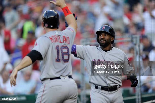 Jackie Bradley Jr. #19 and Mitch Moreland of the Boston Red Sox celebrate after scoring in the second inning against the Washington Nationals at...