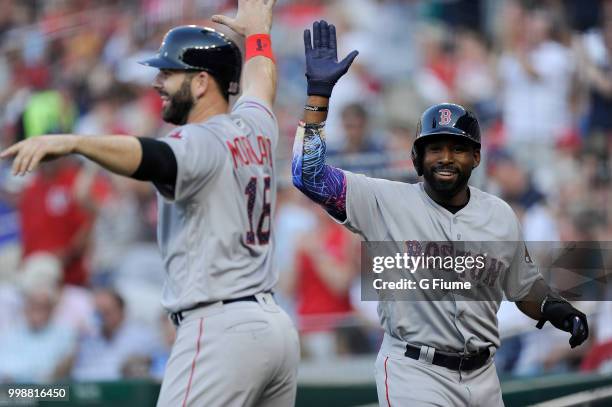 Jackie Bradley Jr. #19 and Mitch Moreland of the Boston Red Sox celebrate after scoring in the second inning against the Washington Nationals at...