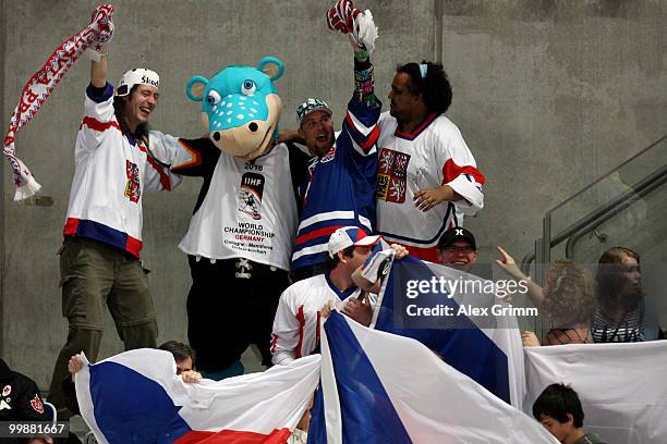 Supporters of Czech Republic celebrate with mascot 'Urmel' during the IIHF World Championship group F qualification round match between Canada and...