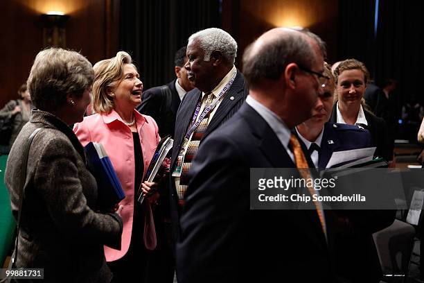 Secretary of State Hillary Clinton talks with committee staff after testifying before the Senate Foreign Relations Committee about the new START...