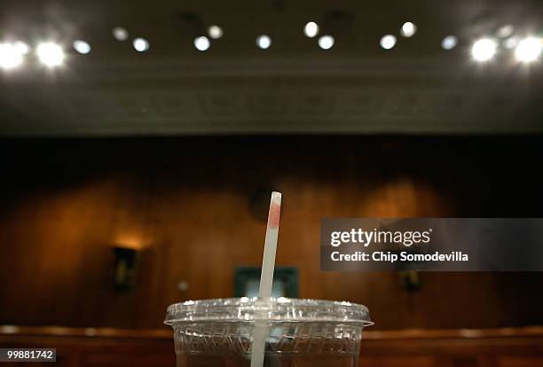 Lipstick is left on the straw of a plastic cup of tea that U.S. Secretary of State Hillary Clinton drank while testifying before the Senate Foreign...