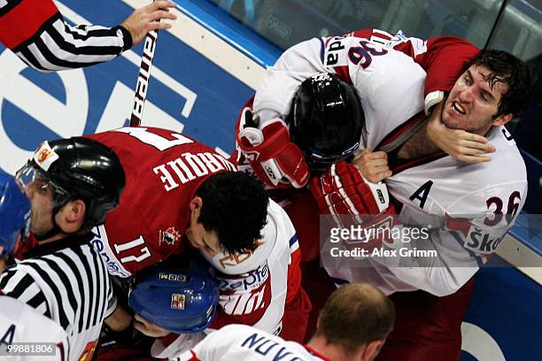 Petr Caslava of Czech Republic fights with Corey Perry of Canada during the IIHF World Championship group F qualification round match between Canada...