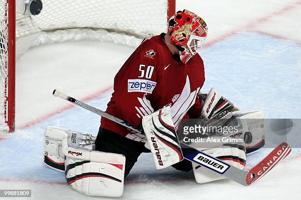 Goalkeeper Chris Mason of Canada makes a save during the IIHF World Championship group F qualification round match between Canada and Czech Republic...