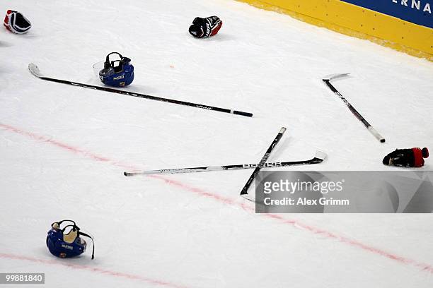 Helmets, gloves and sticks lie on the ice after a fight during the IIHF World Championship group F qualification round match between Canada and Czech...